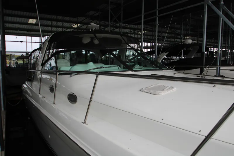 Slide: The Image of Interior view of a 1997 Sea Ray 400 Sundancer yacht with speakers and control panel. - 46