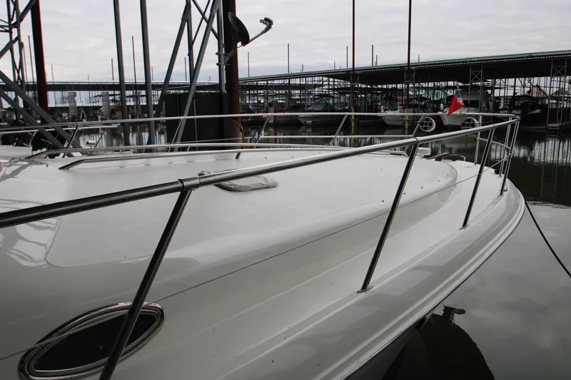 Slide: The Image of 1997 Sea Ray 400 Sundancer yacht docked in a covered marina. - 47