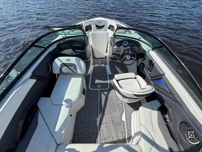 Slide: The Image of Interior of a 2016 Monterey 238 Super Sport boat on water. - 9