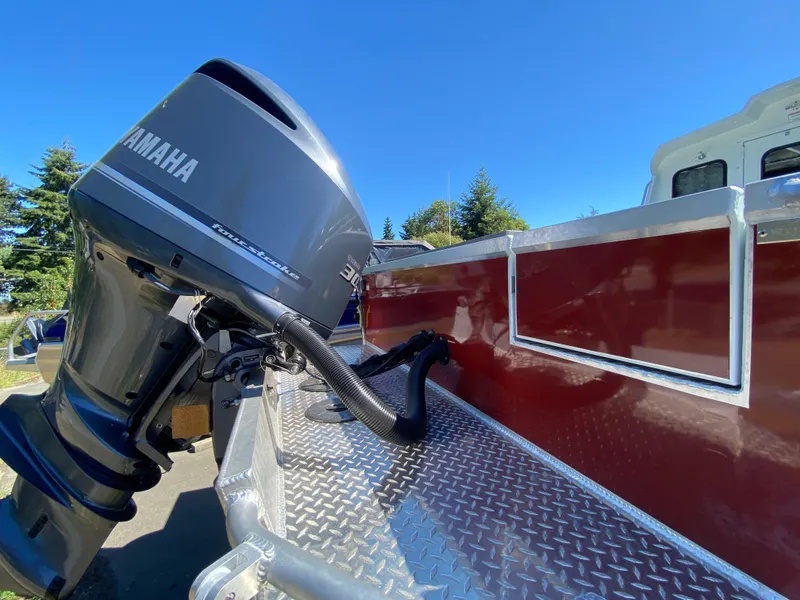 Slide: The Image of 2025 Hewescraft 240 Ocean Pro ET HT with Yamaha outboard motor, sunny day. - 4