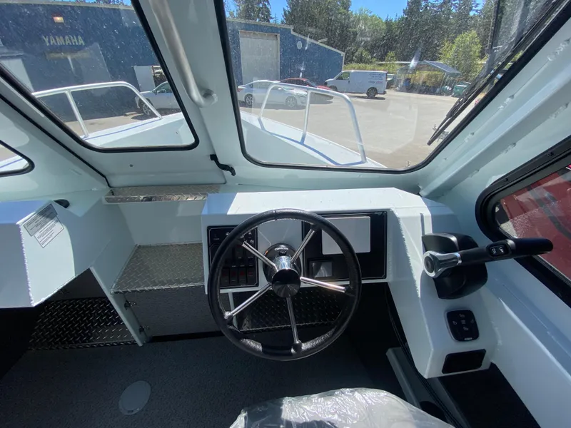Slide: The Image of Interior view of 2025 Hewescraft 240 Ocean Pro ET HT boat cockpit. - 8