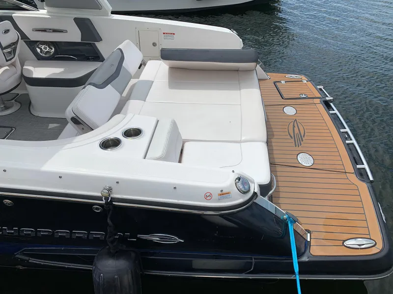 Slide: The Image of 2019 Chaparral 257 SSX boat with spacious seating and teak-style swim platform. - 24
