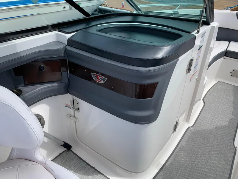 Slide: The Image of 2019 Chaparral 257 SSX boat interior with seating and storage compartments. - 43