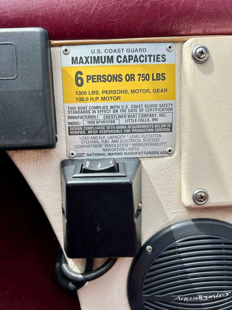 Slide: The Image of 1997 Crestliner 1650 Sportfish capacity label, 6 persons or 750 lbs, U.S. Coast Guard compliant. - 4