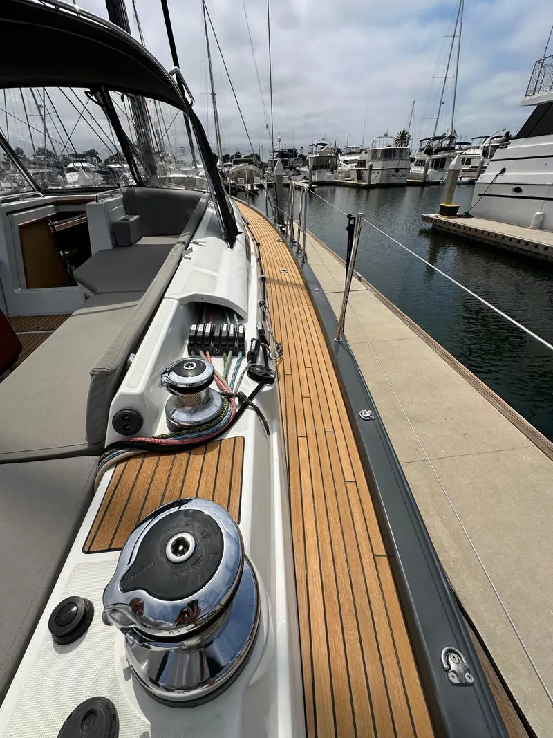 Slide: The Image of 2018 Jeanneau 54 yacht deck with winches, docked at marina. - 39