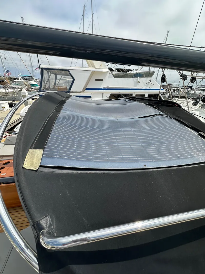 Slide: The Image of 2018 Jeanneau 54 yacht with solar panel on deck, docked at marina. - 42