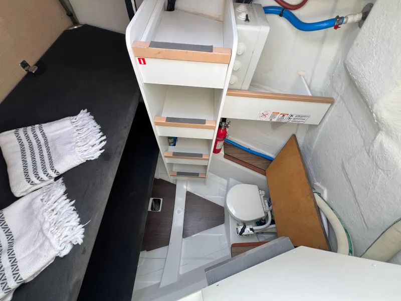 Slide: The Image of 2018 Jeanneau 54 yacht interior with compact bathroom and storage shelves. - 48