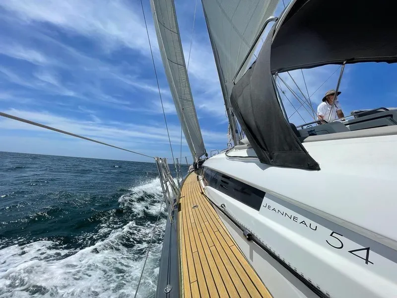 Slide: The Image of Sailing Jeanneau 54 yacht on open sea under clear blue sky, 2018 model. - 5