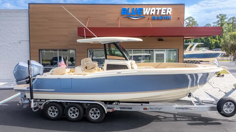 Slide: The Image of 2025 Chris-Craft Catalina 28 boat on trailer at Bluewater Marine dealership. - 11