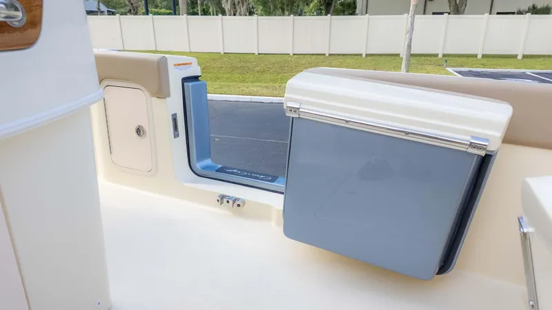 Slide: The Image of 2025 Chris-Craft Catalina 28 boat interior with storage compartment and cooler. - 16