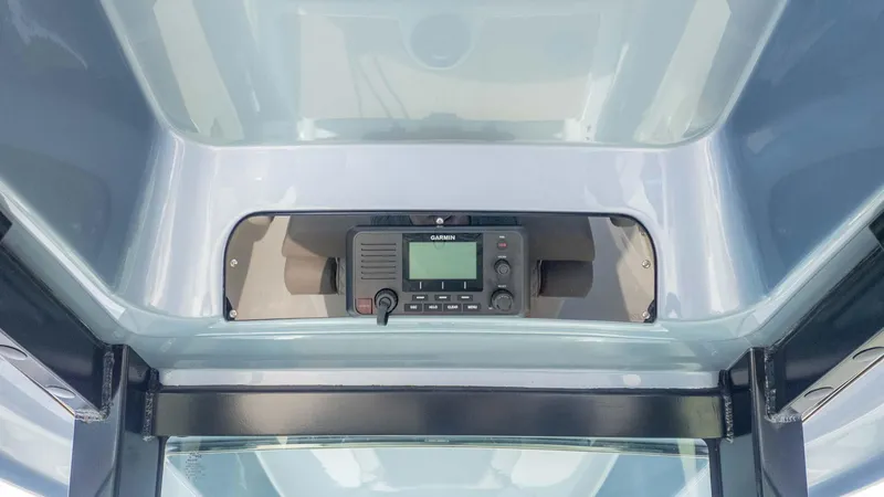 Slide: The Image of 2025 Chris-Craft Catalina 28 boat dashboard with Garmin marine radio. - 22