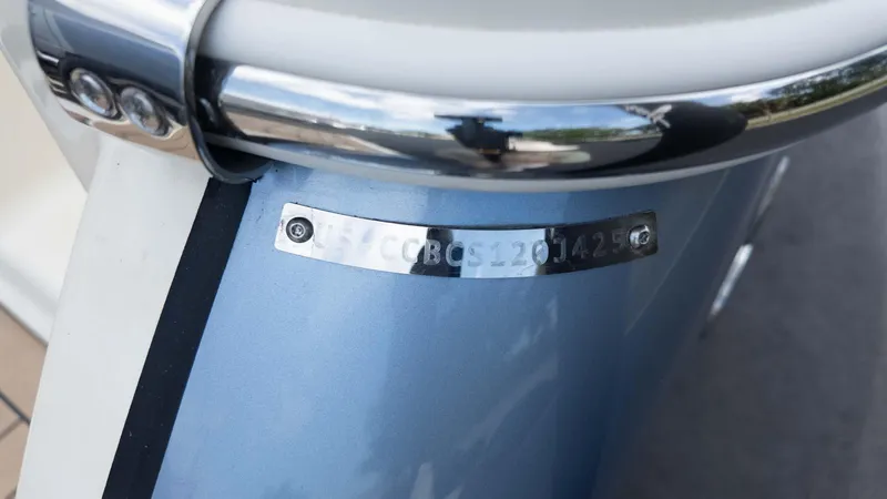 Slide: The Image of 2025 Chris-Craft Catalina 28 boat detail with identification plate and chrome accents. - 6
