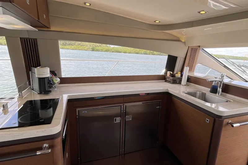 Slide: The Image of Luxurious kitchen interior of 2015 Sea Ray 510 Fly yacht with modern amenities. - 15