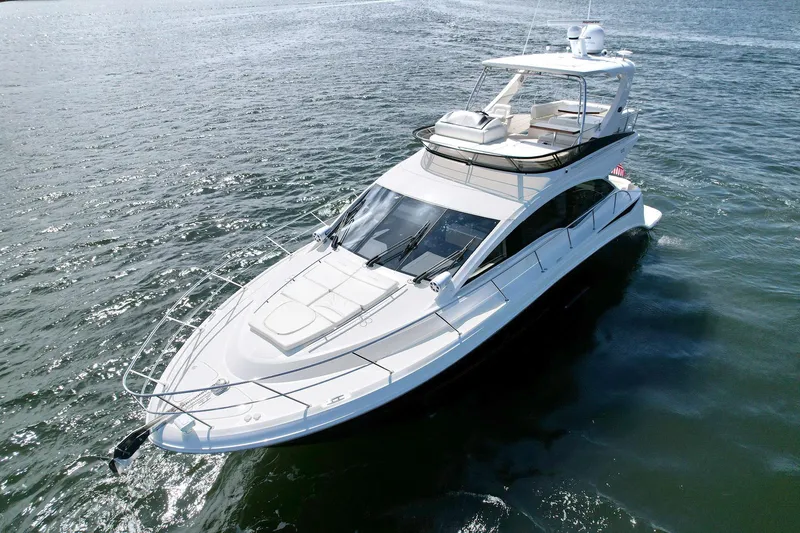 Slide: The Image of 2015 Sea Ray 510 Fly yacht cruising on open water. - 2