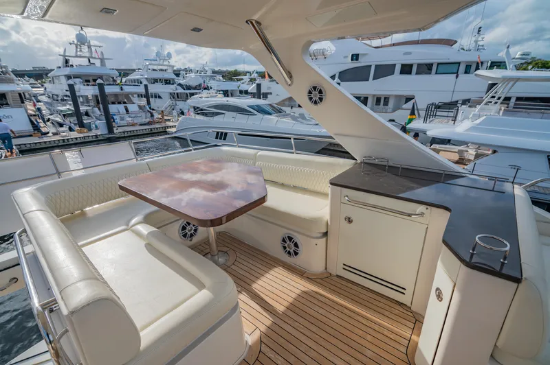 Slide: The Image of Luxurious 2015 Sea Ray 510 Fly yacht with elegant seating and marina view. - 22