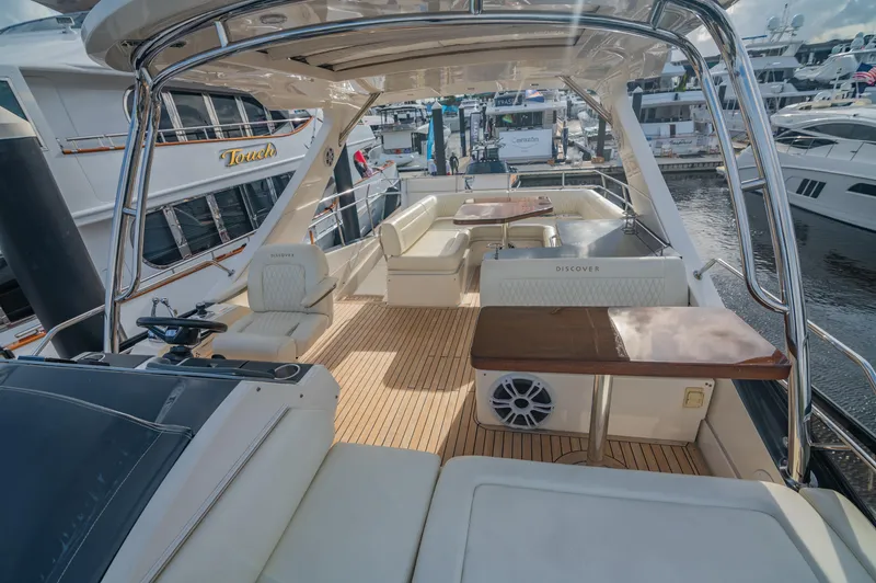 Slide: The Image of Luxurious 2015 Sea Ray 510 Fly yacht with spacious deck and seating area. - 26