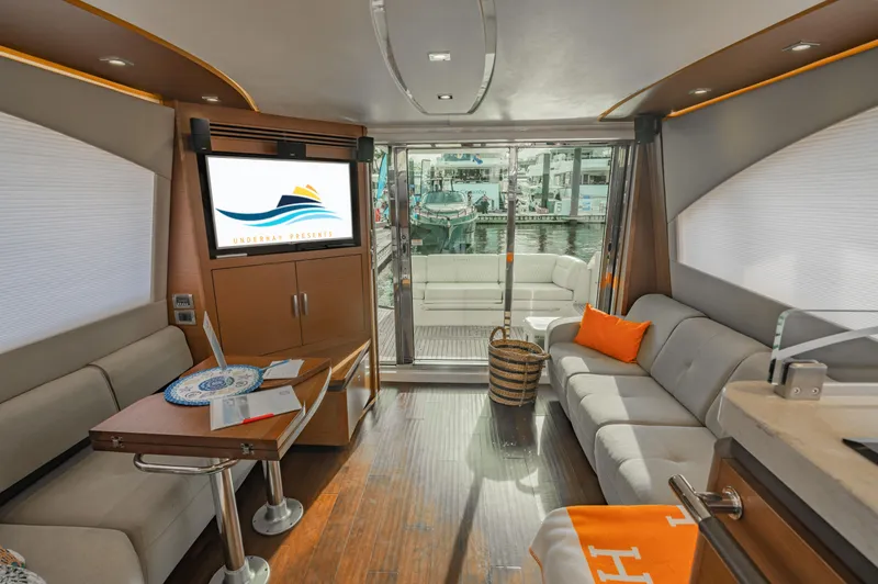 Slide: The Image of Luxurious interior of 2015 Sea Ray 510 Fly yacht with modern furnishings and waterfront view. - 28