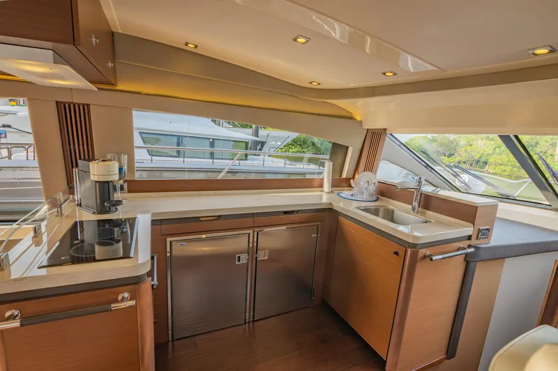 Slide: The Image of Luxurious 2015 Sea Ray 510 Fly yacht kitchen interior with modern appliances. - 30