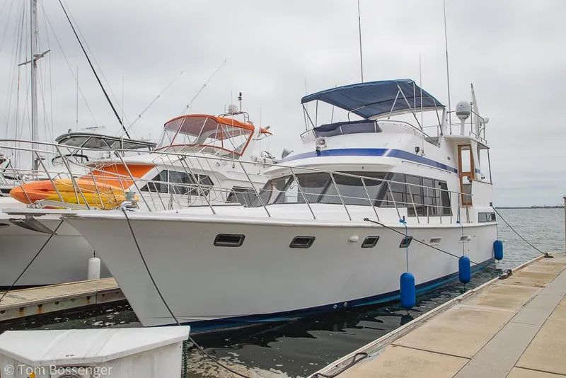 Slide: The Image of 1987 Lien Hwa 47 Elegant MKII Motoryacht docked at marina. - 1