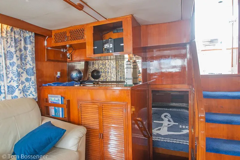 Slide: The Image of Interior of 1987 Lien Hwa 47 Elegant MKII Motoryacht with wood paneling and nautical decor. - 12