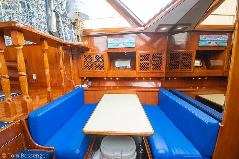 Slide: The Image of Interior of 1987 Lien Hwa 47 Elegant MKII Motoryacht with blue seating and wooden cabinetry. - 21