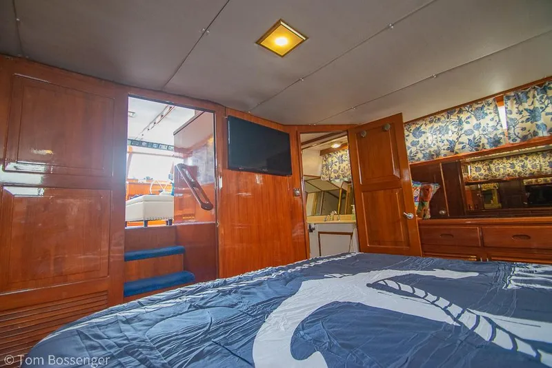 Slide: The Image of Interior of 1987 Lien Hwa 47 Elegant MKII Motoryacht with wood paneling and floral curtains. - 26