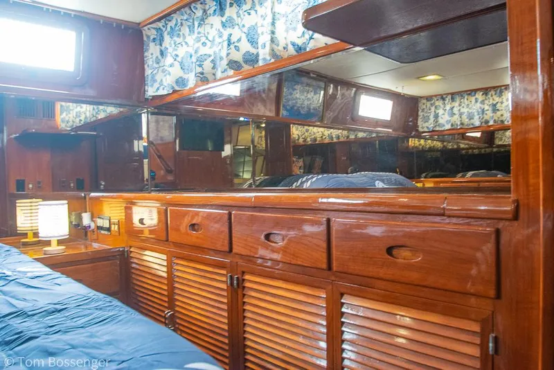 Slide: The Image of Interior of 1987 Lien Hwa 47 Elegant MKII Motoryacht with wooden cabinetry and floral curtains. - 29