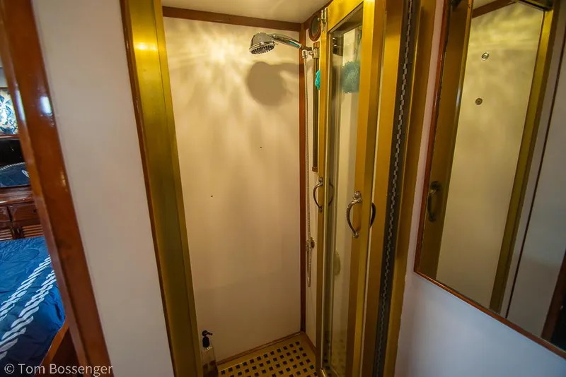 Slide: The Image of Shower area in 1987 Lien Hwa 47 Elegant MKII Motoryacht with glass doors and wooden accents. - 31