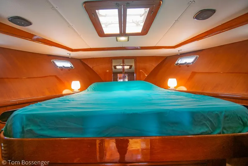 Slide: The Image of Luxurious cabin interior of 1987 Lien Hwa 47 Elegant MKII Motoryacht with teal bedding. - 33