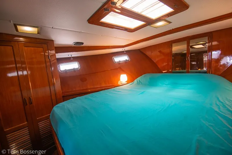 Slide: The Image of Luxurious cabin interior of 1987 Lien Hwa 47 Elegant MKII Motoryacht with teal bedding. - 34