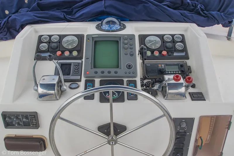 Slide: The Image of Control panel of 1987 Lien Hwa 47 Elegant MKII Motoryacht with steering wheel and navigation instruments. - 46
