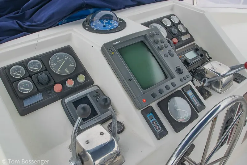 Slide: The Image of Helm controls of 1987 Lien Hwa 47 Elegant MKII Motoryacht with navigation instruments. - 48