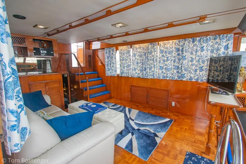 Slide: The Image of Luxurious interior of 1987 Lien Hwa 47 Elegant MKII Motoryacht with blue accents and wood finish. - 5