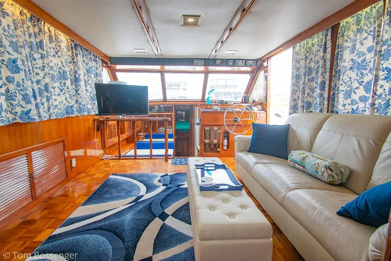 Slide: The Image of 1987 Lien Hwa 47 Elegant MKII Motoryacht interior with plush seating and nautical decor. - 7