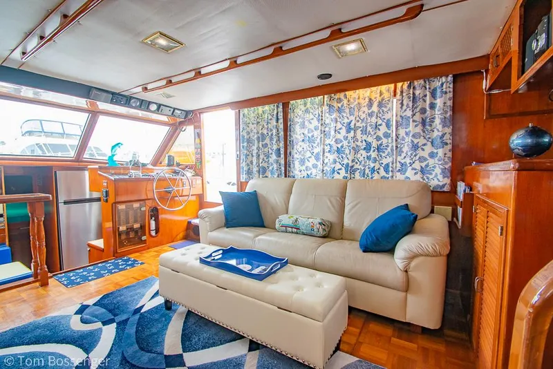Slide: The Image of Luxurious interior of 1987 Lien Hwa 47 Elegant MKII Motoryacht with plush seating and nautical decor. - 8
