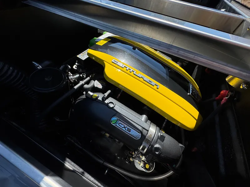 Slide: The Image of 2025 Centurion RI 245 engine compartment with yellow cover and visible components. - 10