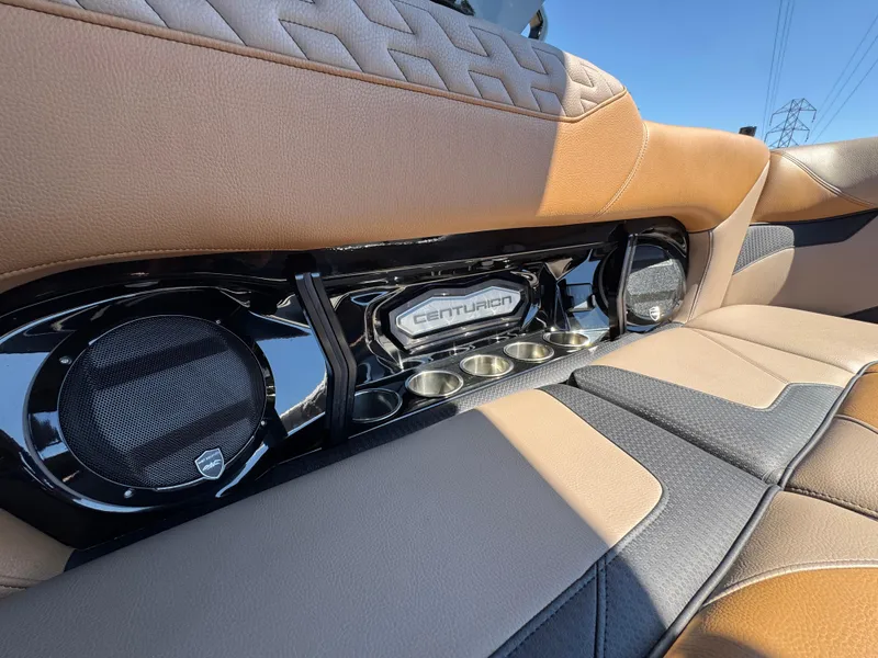 Slide: The Image of 2025 Centurion RI 245 boat interior with premium leather seats and built-in speakers. - 14