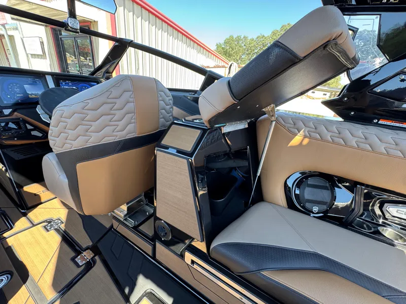 Slide: The Image of Interior of 2025 Centurion RI 245 boat featuring luxurious seating and modern dashboard controls. - 15