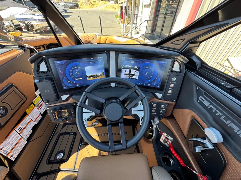 Slide: The Image of 2025 Centurion RI 245 boat dashboard with dual touchscreens and modern controls. - 20