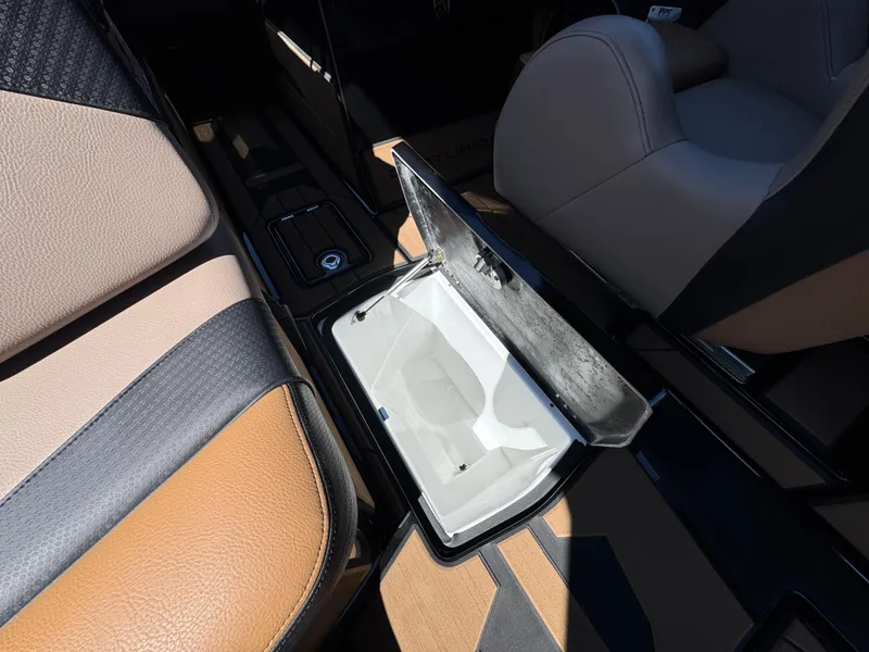 Slide: The Image of Interior of 2025 Centurion RI 245 boat with open storage compartment. - 27