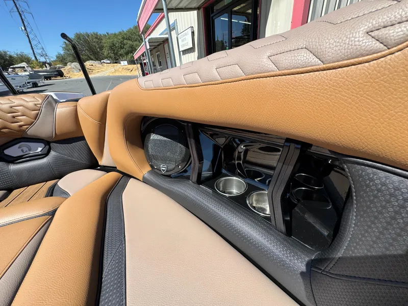 Slide: The Image of Luxurious interior of 2025 Centurion RI 245 boat with premium leather seats and cup holders. - 28