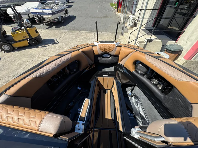 Slide: The Image of 2025 Centurion RI 245 boat interior with tan leather seating and modern design. - 32