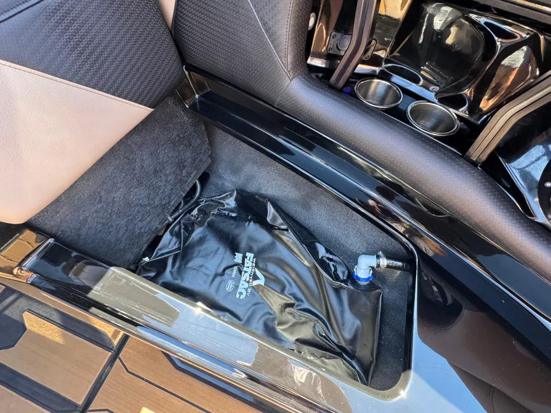 Slide: The Image of 2025 Centurion RI 245 interior storage with FatSac ballast bag and cup holders. - 33