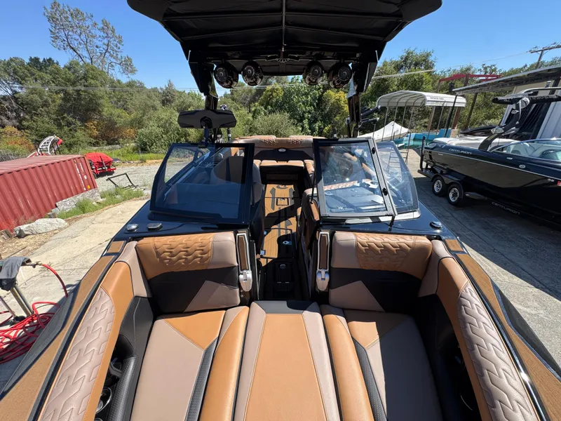 Slide: The Image of 2025 Centurion RI 245 boat interior with luxurious brown seating and modern design. - 34