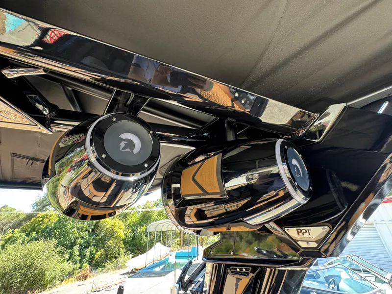 Slide: The Image of 2025 Centurion RI 245 boat speakers, sleek black design, outdoor setting. - 37