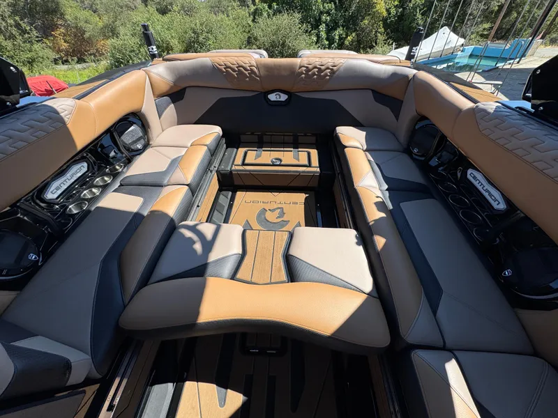 Slide: The Image of Luxurious interior of 2025 Centurion RI 245 boat with tan and black seating. - 39