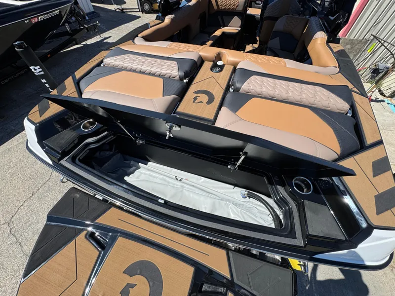 Slide: The Image of 2025 Centurion RI 245 boat interior with open storage compartments and stylish seating. - 4