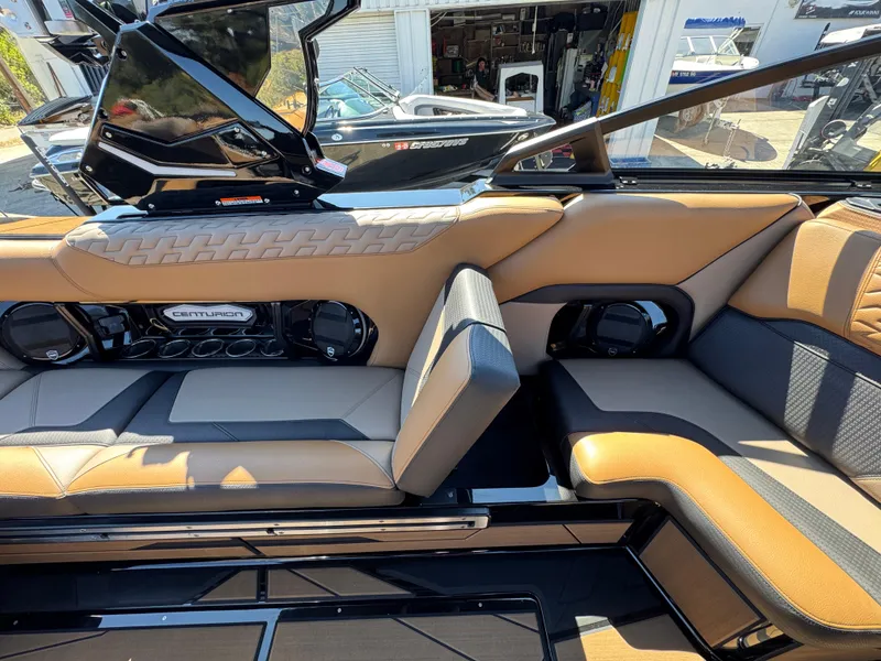 Slide: The Image of Interior of 2025 Centurion RI 245 boat with luxurious seating and audio system. - 40