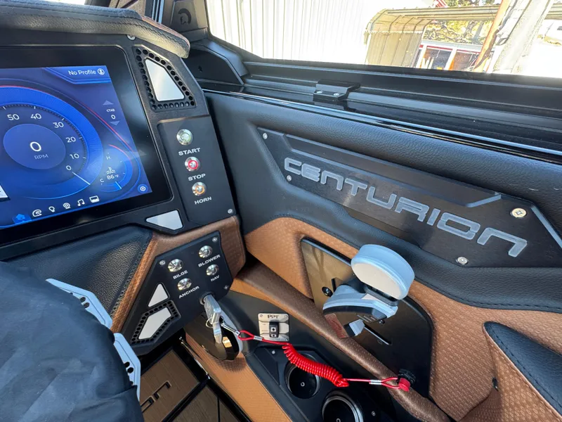Slide: The Image of Interior of 2025 Centurion RI 245 boat with control panel and touchscreen display. - 42