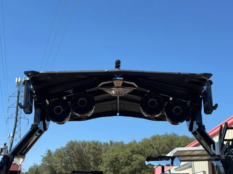 Slide: The Image of 2025 Centurion RI 245 boat tower with speakers against clear blue sky. - 49